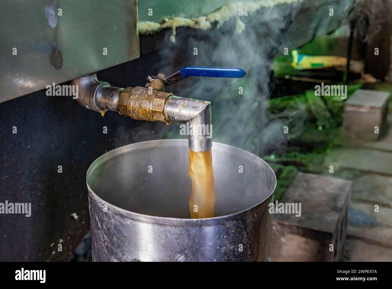 Finished maple syrup drawn from evaporator on an Amish farm in Michigan