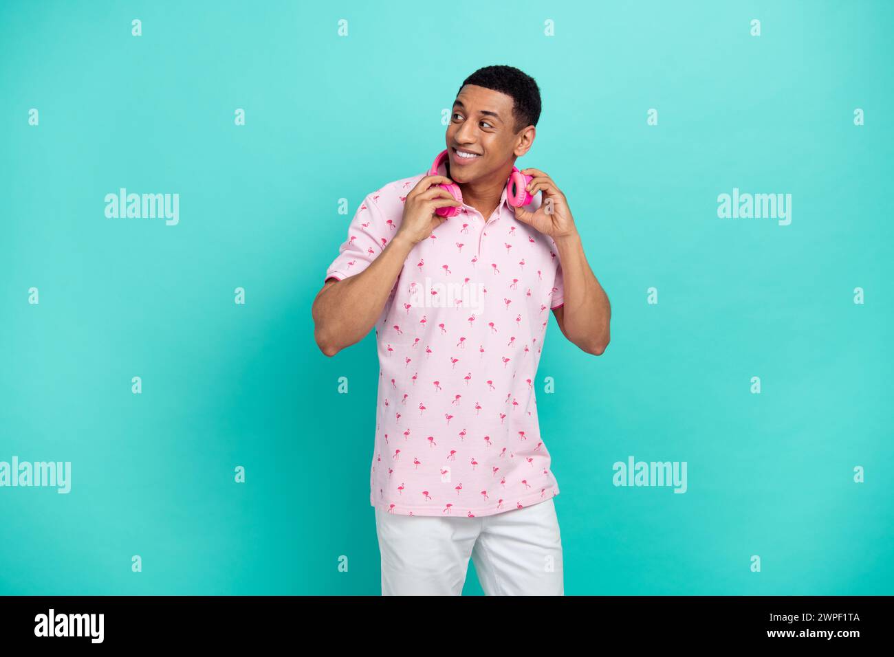 Photo of cheerful person hands touch hang neck headphones look empty