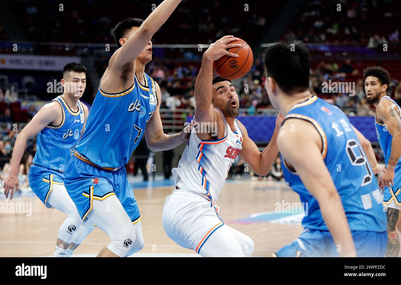 Beijing, China. 7th Mar, 2024. Venkatesha Jois (C) of Sichuan Blue Whales grabs the ball during the 40th round match between Beijing Ducks and Sichuan Blue Whales at the 2023-2024 Chinese Basketball Association (CBA) league in Beijing, capital of China, March 7, 2024. Credit: Wang Lili/Xinhua/Alamy Live News Stock Photo
