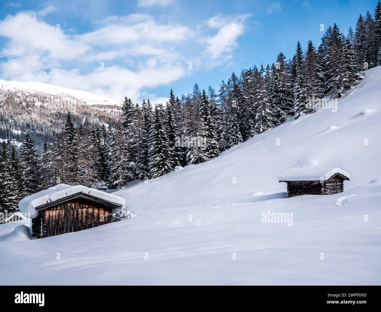This winter image in the Obernbergtal valley of hay barns, is not far from the town of Steinach am Brenner located on the old Brenner Pass road Stock Photo