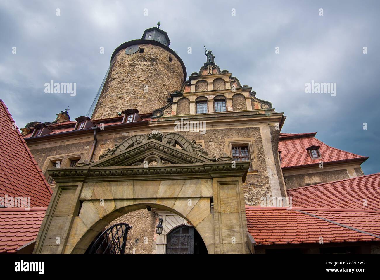 The front wall of Czocha Castle was built in the 13th century as a border stronghold.  It currently serves as a hotel and tourist attraction.  Sucha, Stock Photo