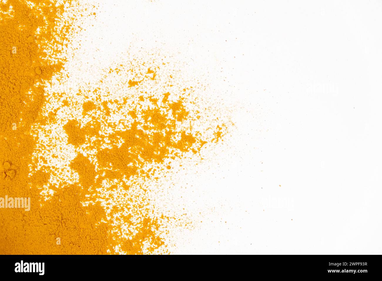 Scattered turmeric powder on white background, turmeric pattern and ...