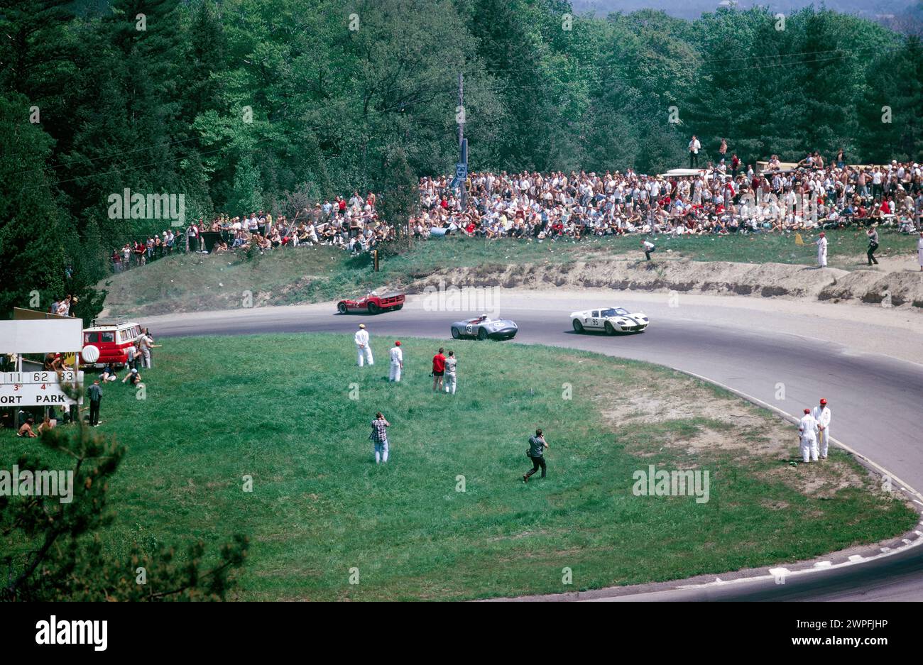 Chris Amon in a McLaren Elva Mark II backwards in Moss Corner at the at the 1966 Players 200 Mosport Canadian Sports Car Championship round 3 at Mosport Park Canada, finished 3rd Stock Photo