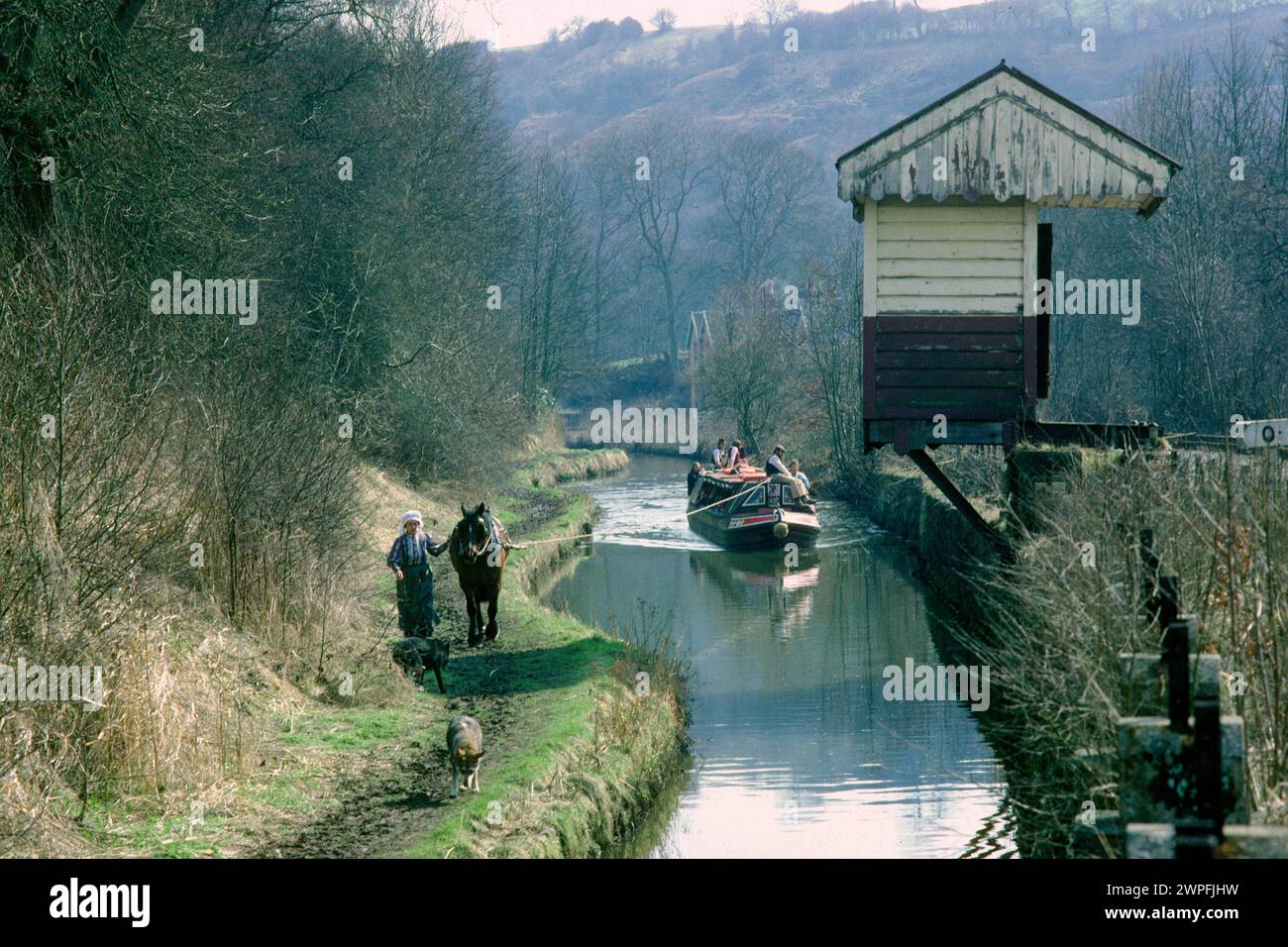 Consall station on the Churnet Valley Railway in 1979 before restoration, with horse-drawn narrowboat on the Caldon Canal, Consall Forge, Staffordshire Stock Photo