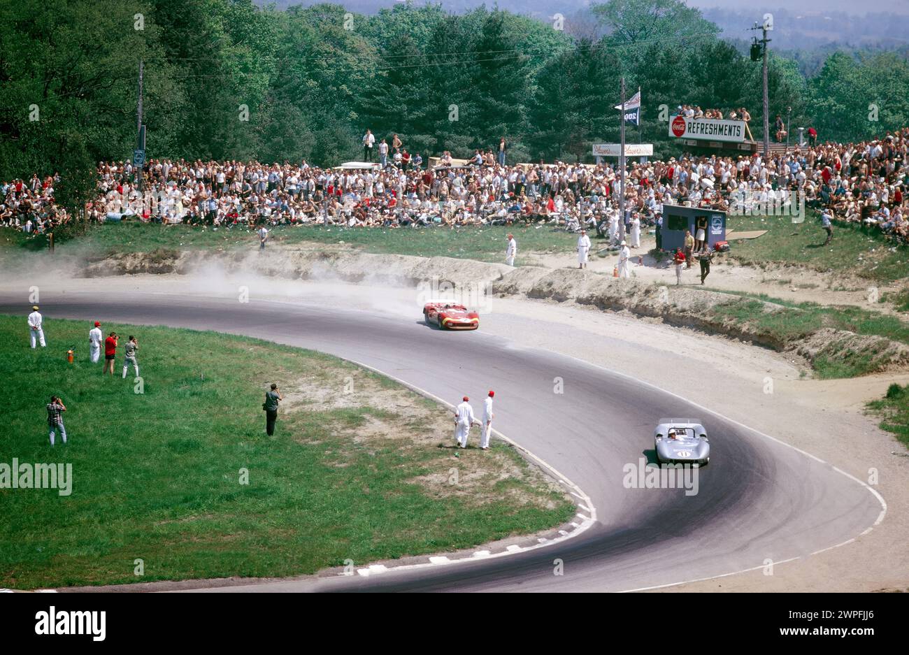 Lothar Motschenbacher #11 and Chris Amon #2 in McLaren Elva Mark IIs in Moss Corner at the 1966 Players 200 Mosport Canadian Sports Car Championship round 3 at Mosport Park Canada Stock Photo