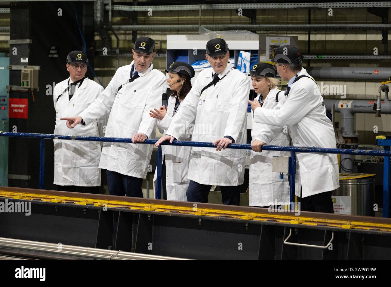 La Hague, France. 07th Mar, 2024. French Minister for Economy and Finances Bruno Le Maire flanked by CEO of the Orano group Nicolas Maes and French Deputy Minister for Industry and Energy Roland Lescure, Director of Orano la Hague Stephanie Gaiffe look at the nuclear waste storage pool, at Orano la Hague, a nuclear fuel reprocessing plant, in La Hague, northwestern France, on March 7, 2024. Photo by Raphael Lafargue/ABACAPRESS.COM Credit: Abaca Press/Alamy Live News Stock Photo