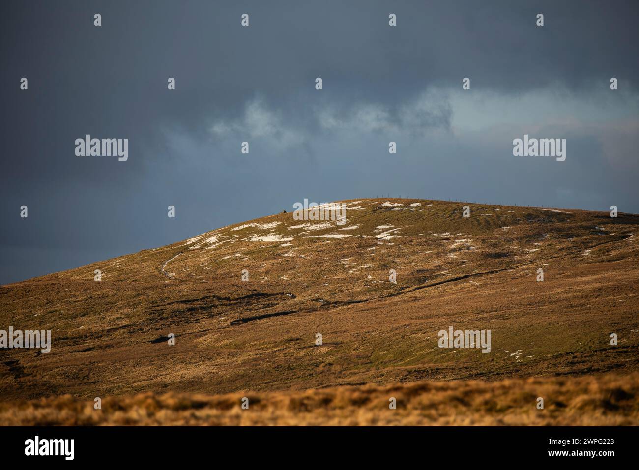 Remains of recent snowfall on the fells at Hartside Pass, Cumbria Stock Photo