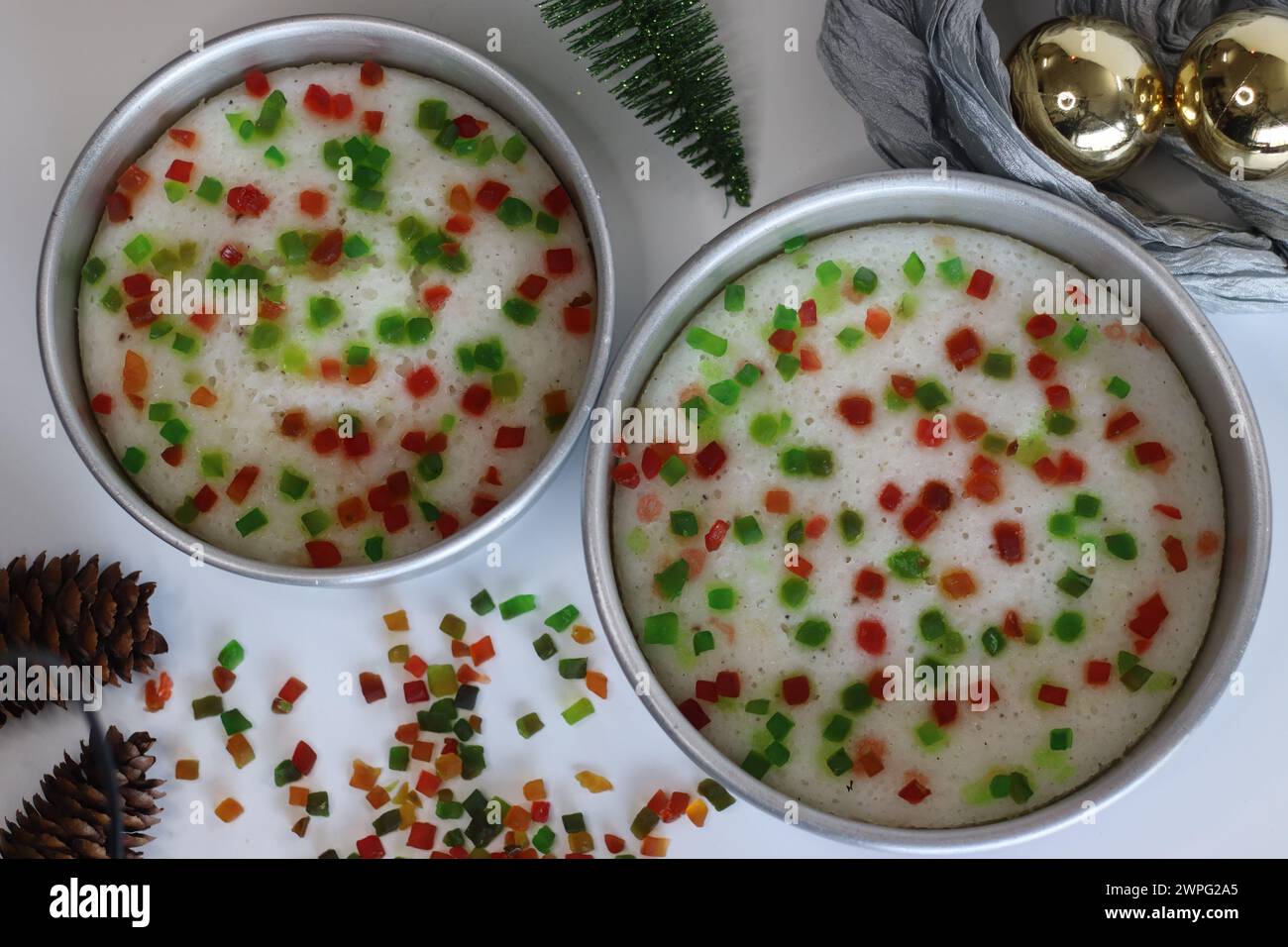 Vattayappam with tutti fruity, a Kerala sweet dish. Vattayappam is a steamed rice cake with coconut and yeast. Tutti fruity are candied fruits. Shot o Stock Photo