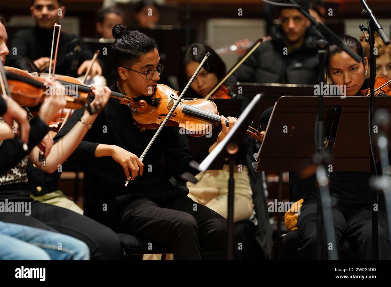 Members of the Afghan Youth Orchestra (AYO) practice for their Breaking the Silence tour at London's Southbank Centre, Royal Festival Hall. The Home Office initially refused the AYO's application for visas, but after the provision of additional information, the government department granted them entry. Picture date: Thursday March 7, 2024. Stock Photo