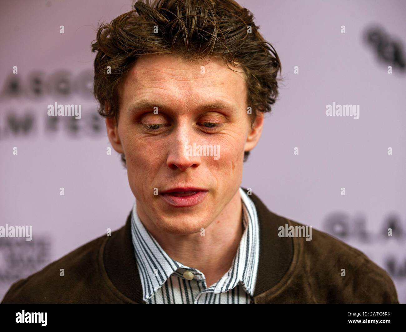 Glasgow, Scotland, UK. 7th Mar, 2024. Actor, George MacKay, on the red carpet at a photo call for a sold-out screening of The Beast, at the Glasgow Film Theatre (GFT), Scotland. 'French auteur, Bertrand Bonello, presents a bold, centuries-spanning tale of romance and obsession in the shadow of an impending catastrophe, freely adapted from Henry James' The Beast in the Jungle.' The Glasgow Film Festival 2024 (GFF) runs until 10th March, 2024. Credit: Stewart Kirby for #creativezealots/Alamy Live News Stock Photo