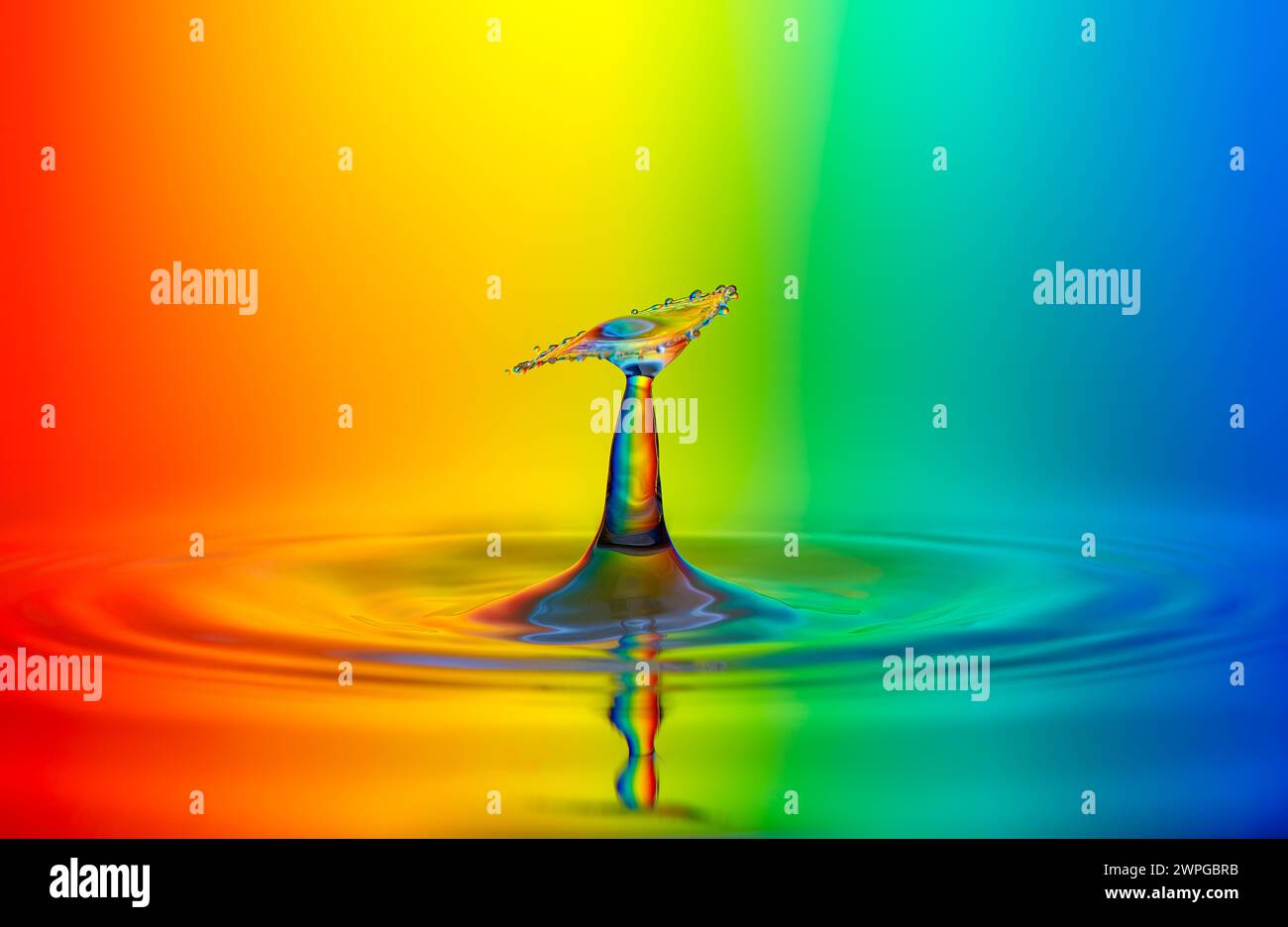 Water droplets with rainbow-colored background Stock Photo