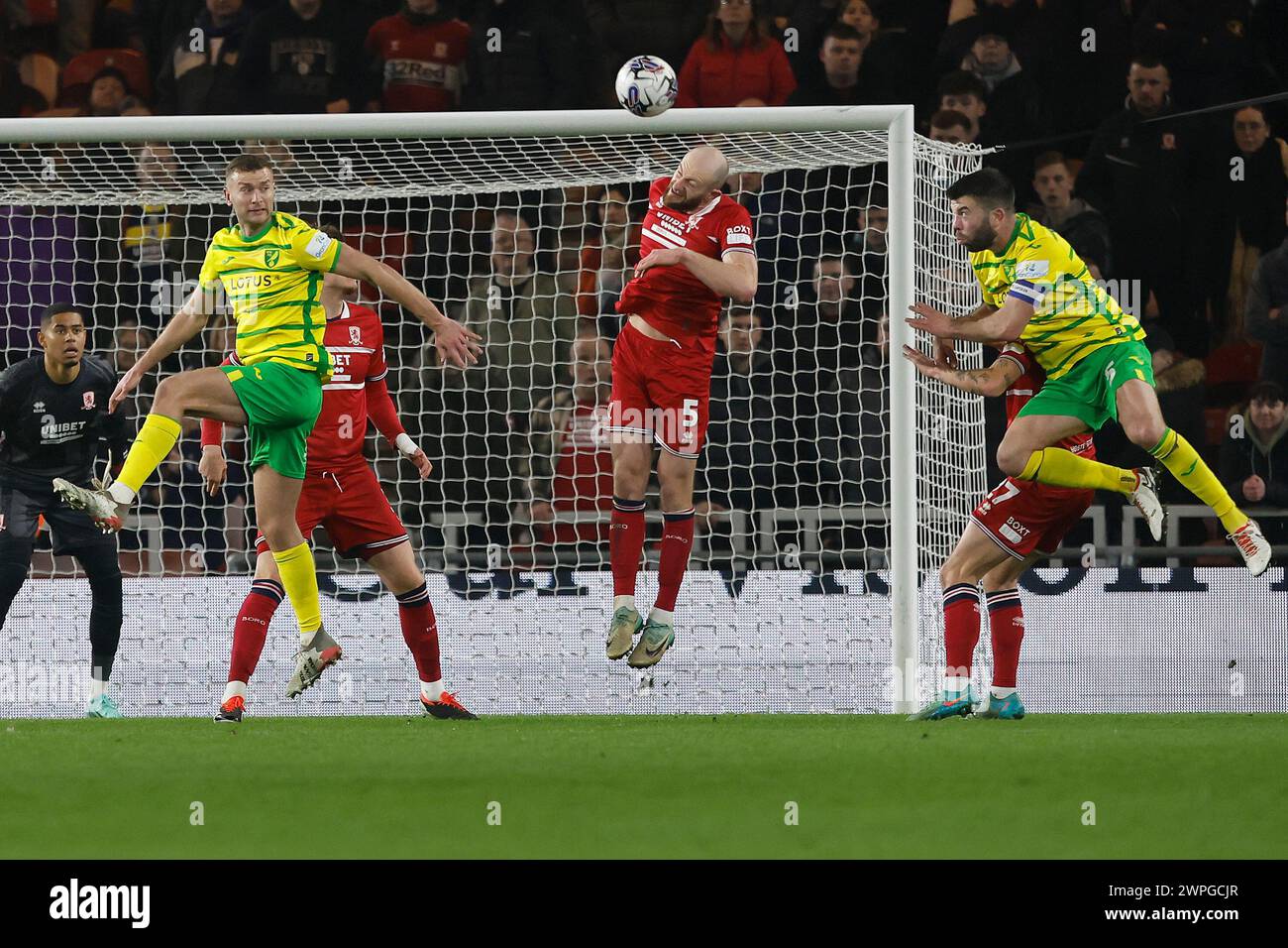 Middlesbrough's Matthew Clarke heads clear from Norwich City's Ben Gibson (L) and Grant Hanley during the Sky Bet Championship match between Middlesbrough and Norwich City at the Riverside Stadium, Middlesbrough on Wednesday 6th March 2024. (Photo: Mark Fletcher | MI News) Credit: MI News & Sport /Alamy Live News Stock Photo
