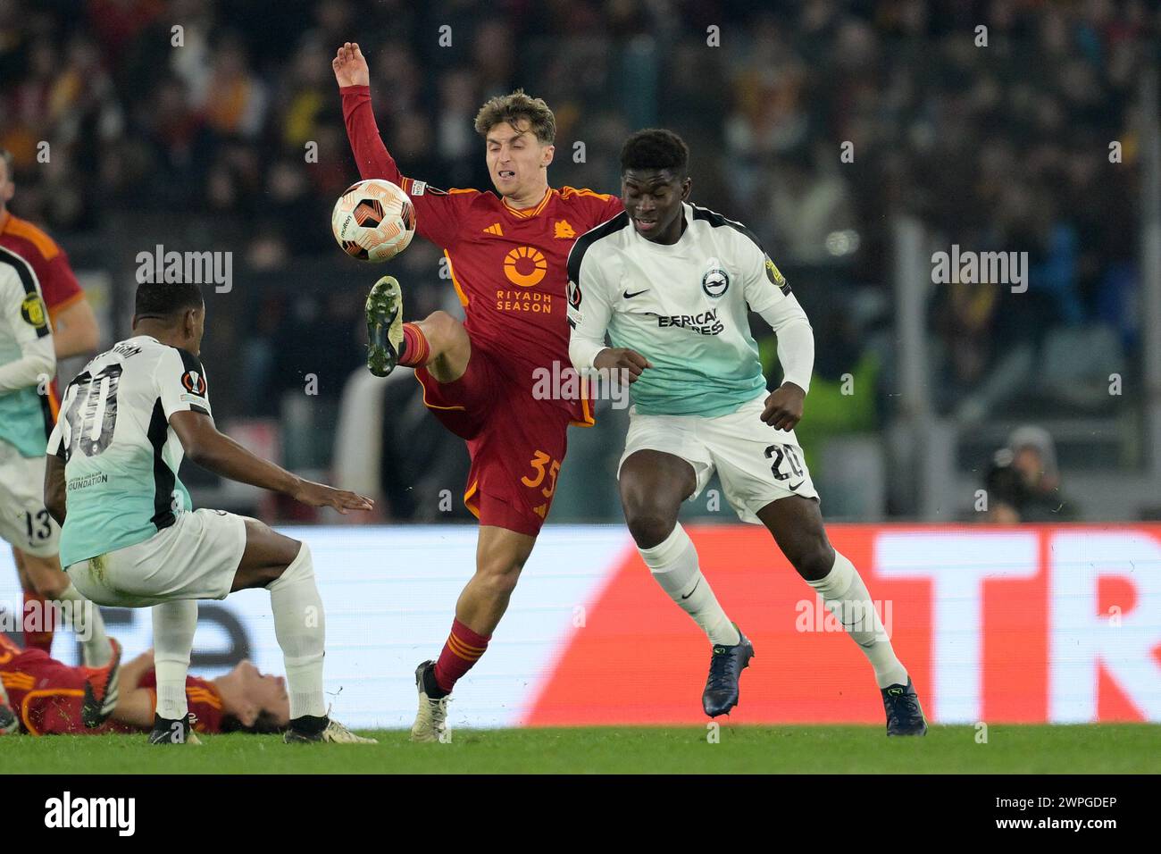 Roma, Italia. 07th Mar, 2024. Tommaso Baldanzi (AS Roma) fights for the ball with Carlos Baleba (Brighton) during the UEFA Europe League soccer match between first leg of the round of 16 between Roma and Brighton FC at the Rome's Olympic stadium, Italy - Thursday, March 7, 2024 - Sport Soccer ( Photo by Alfredo Falcone/LaPresse ) Credit: LaPresse/Alamy Live News Stock Photo