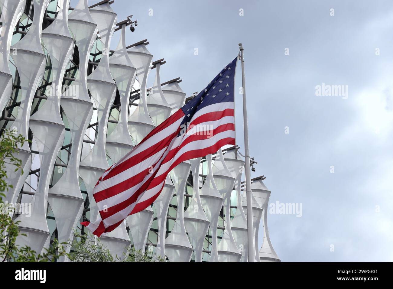 American flag waving at the Embassy of the United States of America in ...