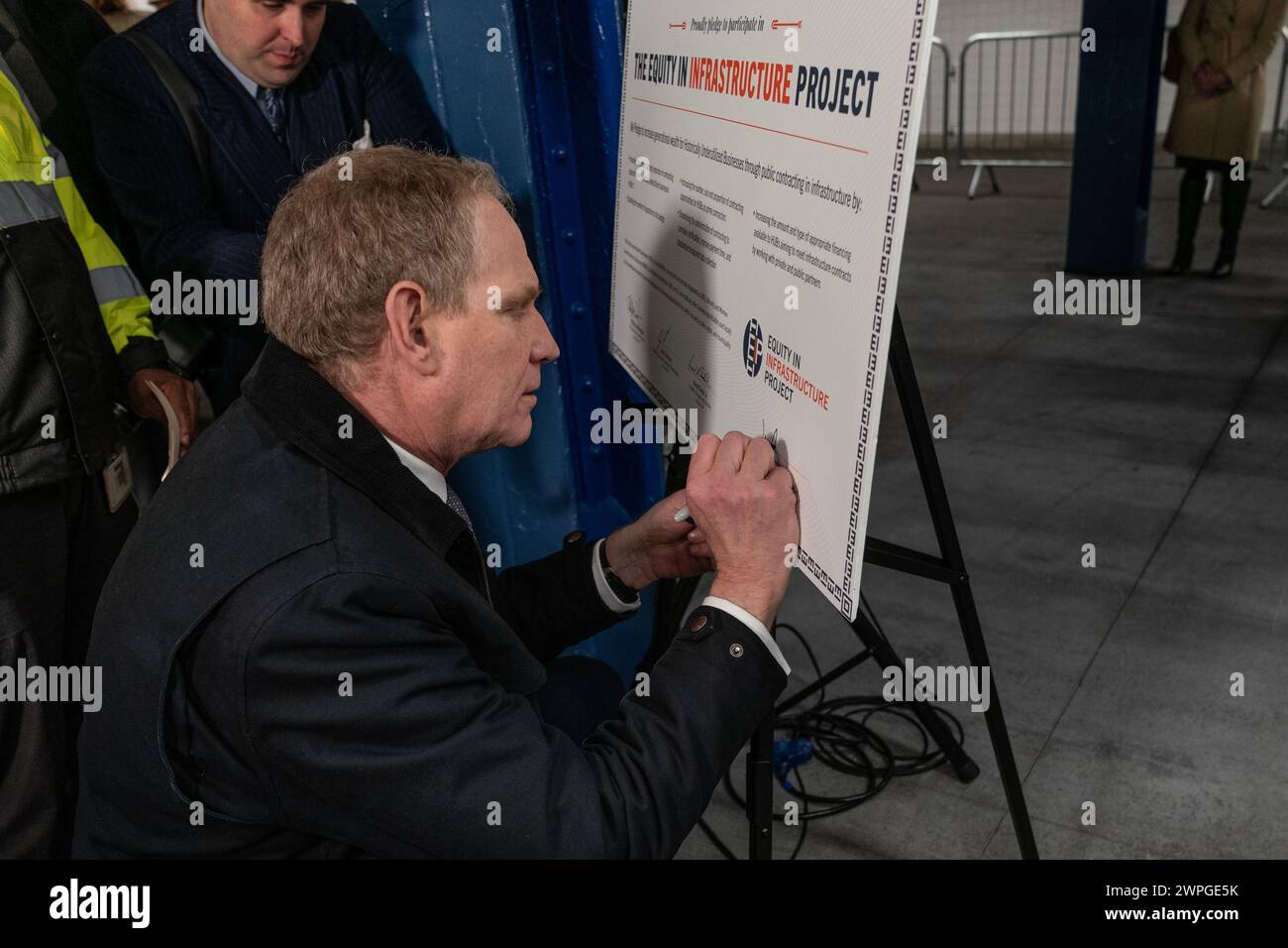 Janno Lieber, MTA Chair and CEO signs pledge during MTA announcement at 14th street subway station in New York on March 7, 2024 Stock Photo