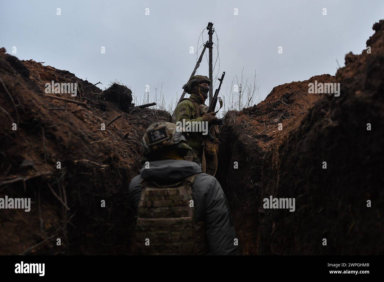 Kyiv, Donetsk Oblast, Ukraine. 7th Mar, 2024. Ukrainian soldiers walk through a trench system, 100 meters away from Russian lines. Russian infantry positions are 100m away from Ukrainian lines. (Credit Image: © Madeleine Kelly/ZUMA Press Wire) EDITORIAL USAGE ONLY! Not for Commercial USAGE! Stock Photo