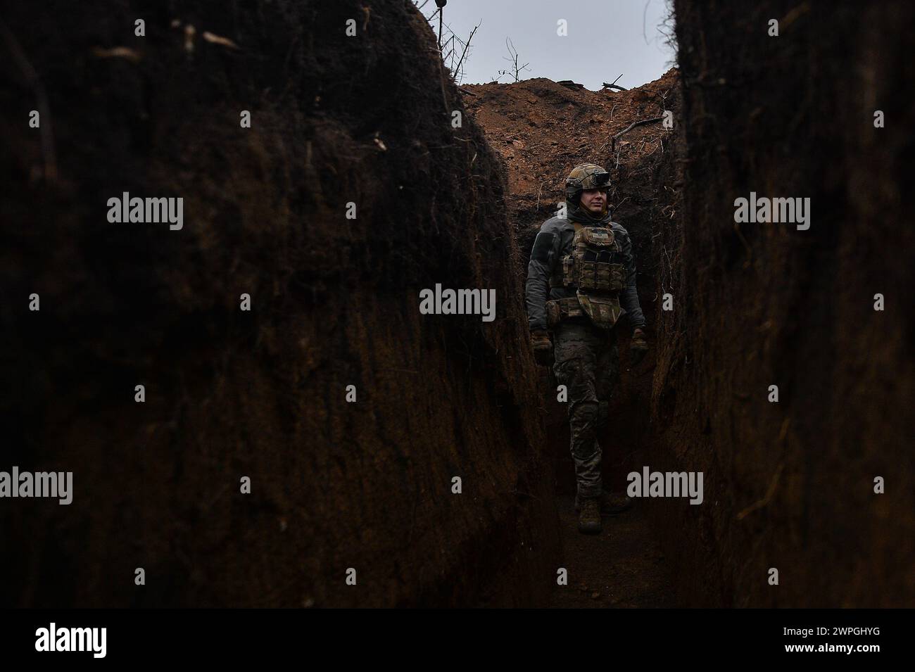 Kyiv, Donetsk Oblast, Ukraine. 7th Mar, 2024. Zhenya, a Ukrainian solider stands inside a trench 100 meters from enemy lines. Russian infantry positions are 100m away from Ukrainian lines. (Credit Image: © Madeleine Kelly/ZUMA Press Wire) EDITORIAL USAGE ONLY! Not for Commercial USAGE! Stock Photo
