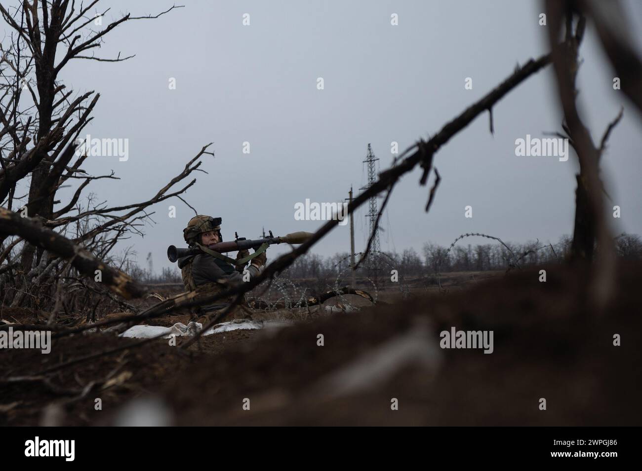 Kyiv, Donetsk Oblast, Ukraine. 7th Mar, 2024. Zhenya, a Ukrainian solider prepares to fire an RPG at enemy lines. Russian infantry positions are 100m away from Ukrainian lines. (Credit Image: © Madeleine Kelly/ZUMA Press Wire) EDITORIAL USAGE ONLY! Not for Commercial USAGE! Stock Photo