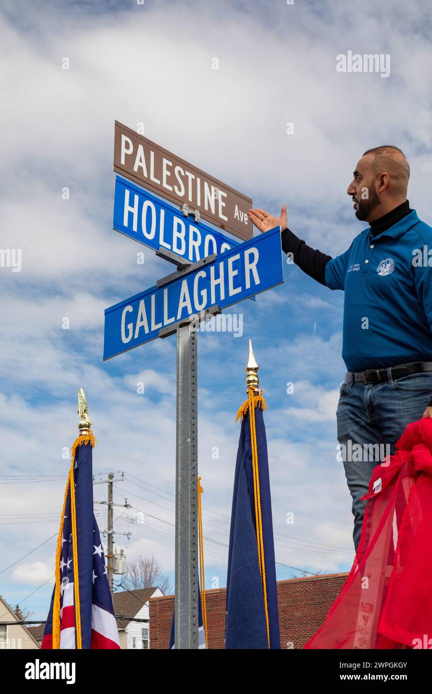 Hamtramck, Michigan, USA. 7th Mar, 2024. City councilman Khalil Refai unveils a sign renaming a major street 'Palestine Avenue.' The action is in solidarity with Palestinians in Gaza, where tens of thousands have died in Israel's bombing campaign. Credit: Jim West/Alamy Live News Stock Photo