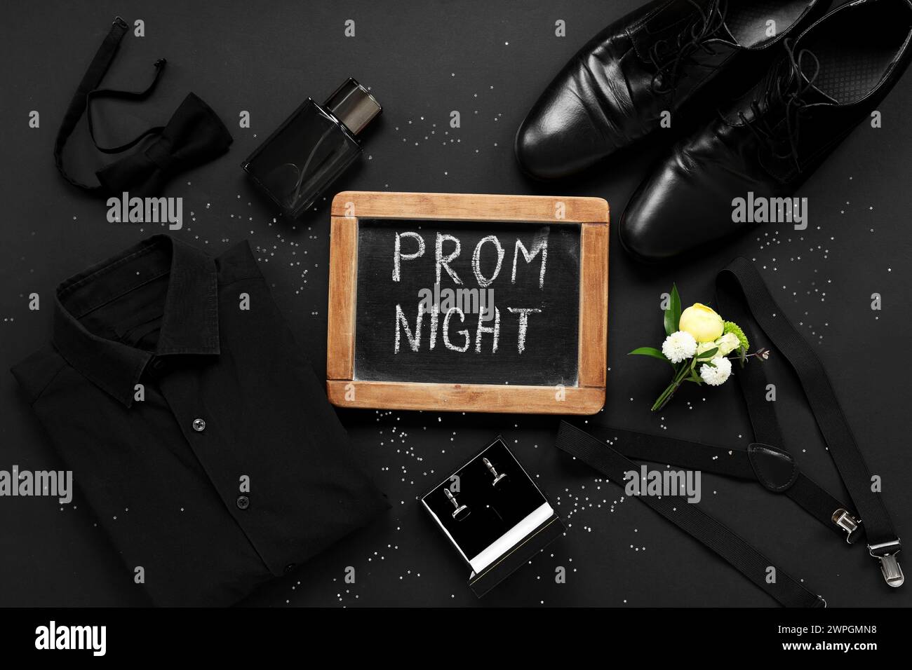 Chalkboard with text PROM NIGHT, male shoes and shirt on black background Stock Photo