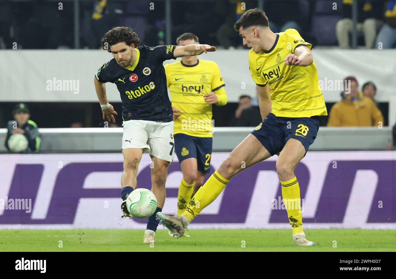Brussels, Belgium. 07th Mar, 2024. Fenerbahce's Ferdi Kadioglu and Union's Ross Sykes fight for the ball during a soccer game between Belgian club Royale Union Saint Gilloise and Turkish club Fenerbahce, on Thursday 07 March 2024 in Brussels, the first leg of the 1/8 finals of the UEFA Conference League competition. BELGA PHOTO VIRGINIE LEFOUR Credit: Belga News Agency/Alamy Live News Stock Photo