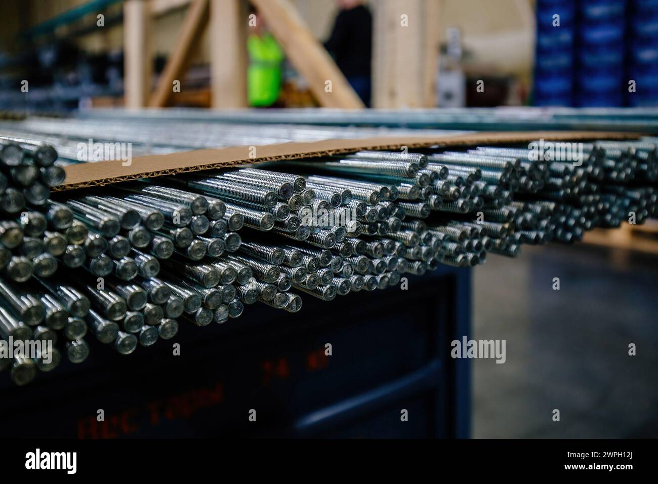 Threaded steel rods, selective focus. Stock Photo