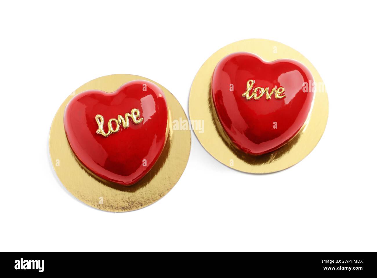 St. Valentine's Day. Delicious heart shaped cakes isolated on white, top view Stock Photo