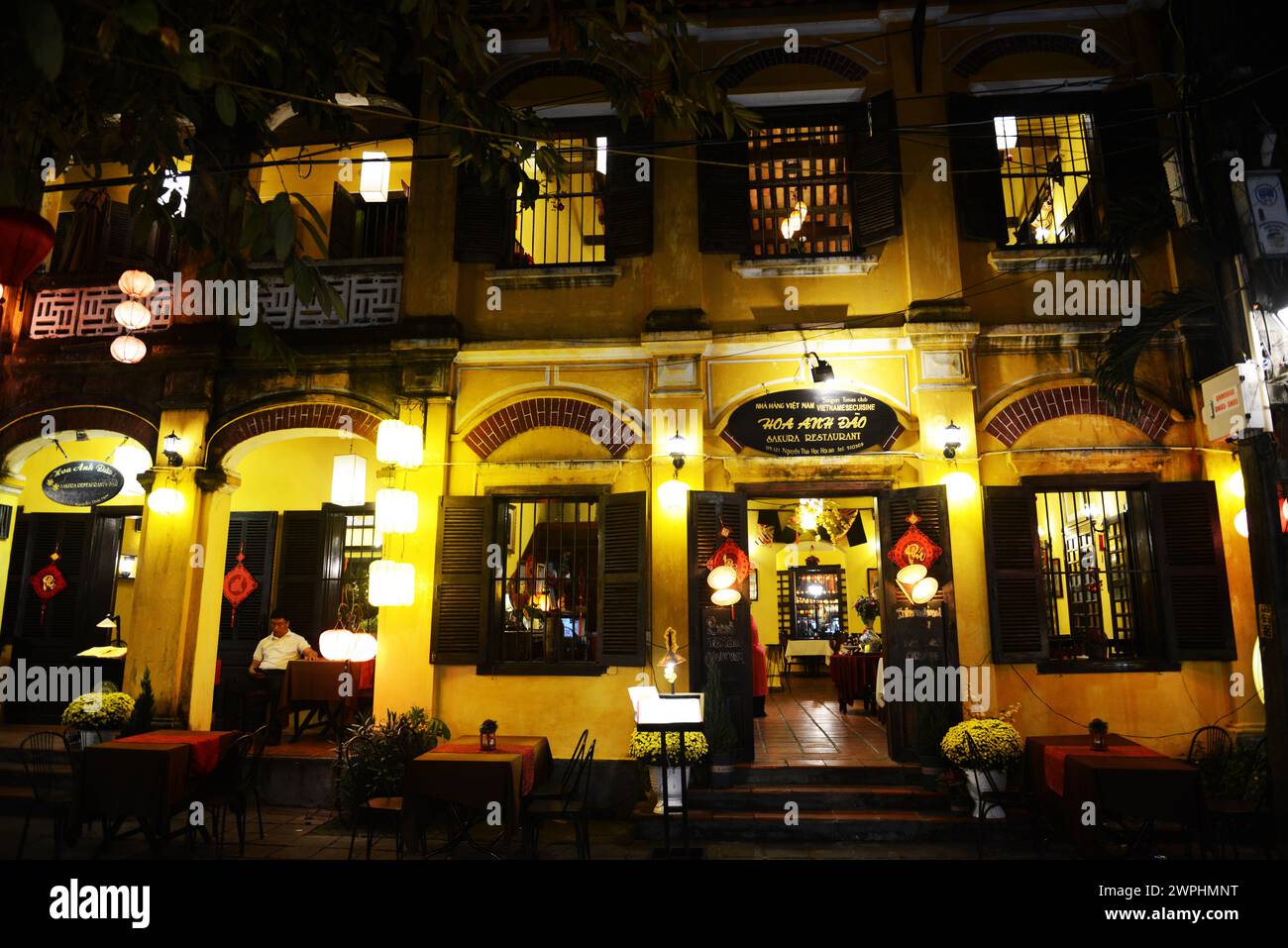 Sakura restaurant at night. Old city of Hoi An, Vietnam. Stock Photo