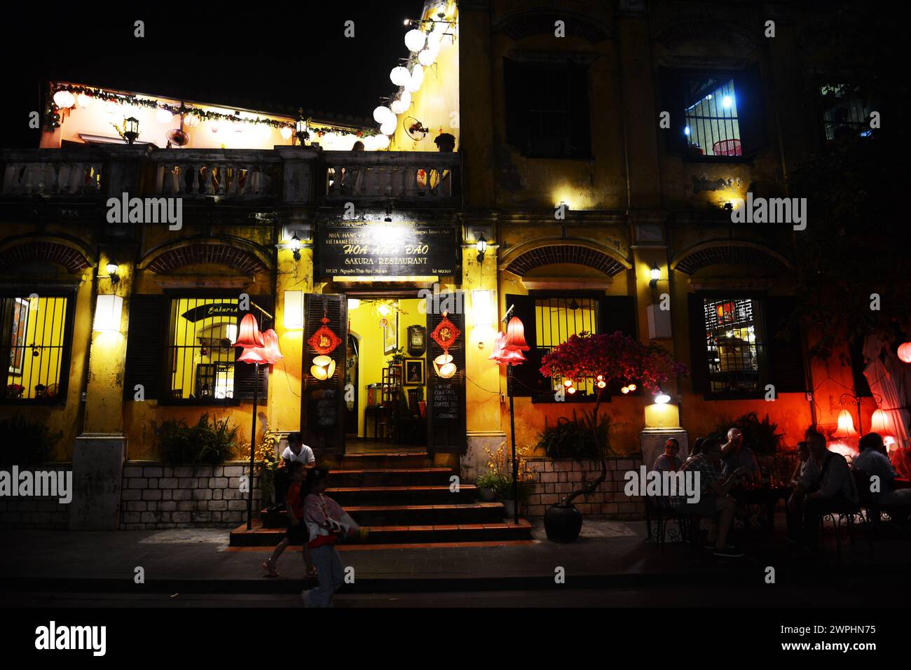Sakura restaurant at night. Old city of Hoi An, Vietnam. Stock Photo
