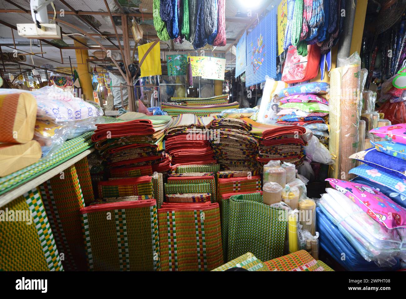 Traditional floor mats displayed by a souvenir shop in the old city of Hoi An, Vietnam. Stock Photo