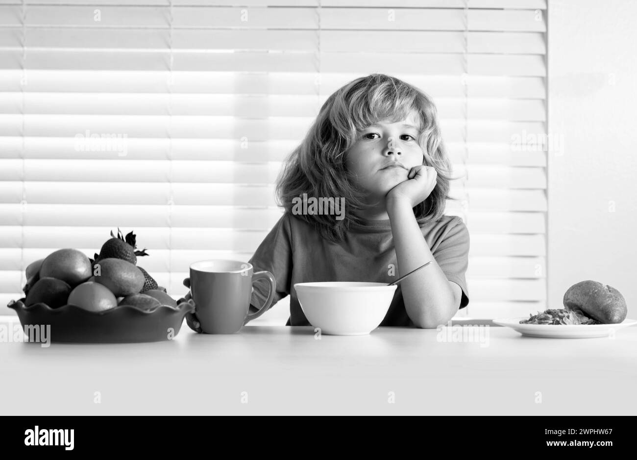 schoolkid-eating-breakfast-before-school-portrait-of-child-sit-at-desk