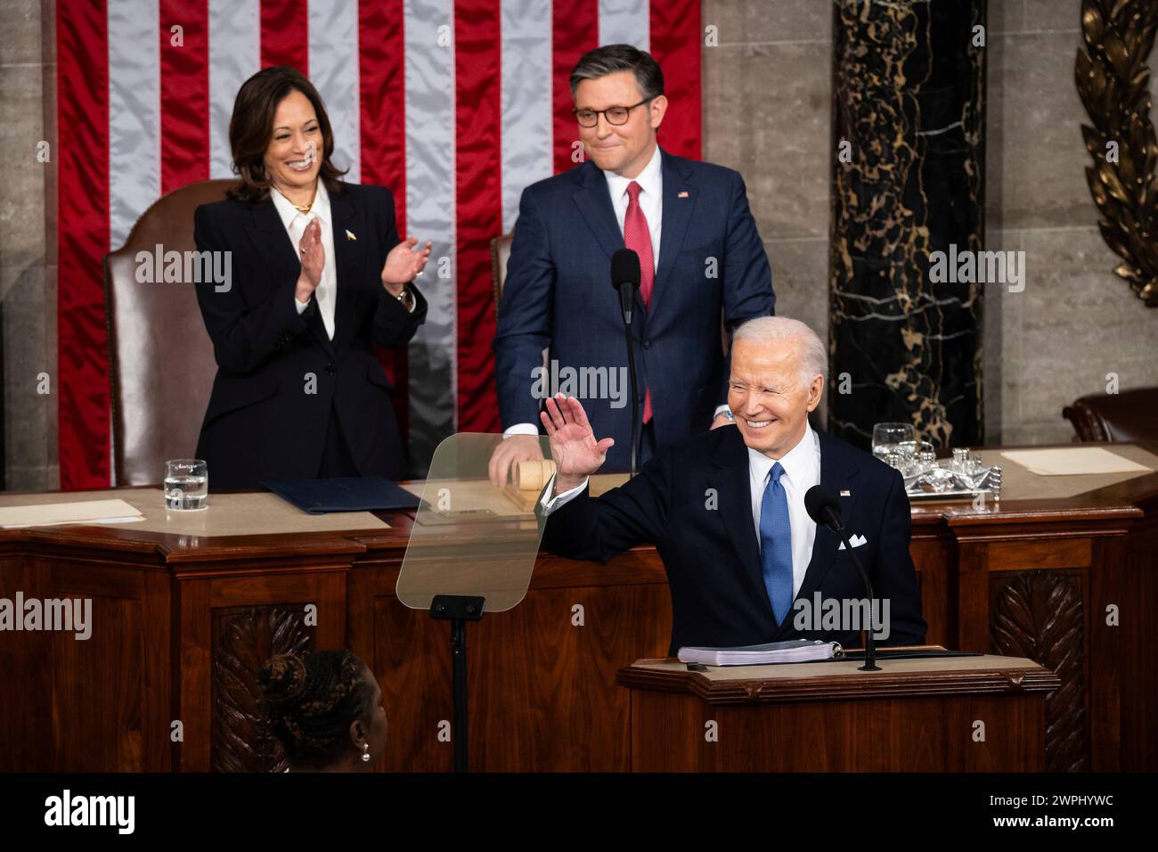 President Joe Biden, flanked by Vice President Kamala Harris and House