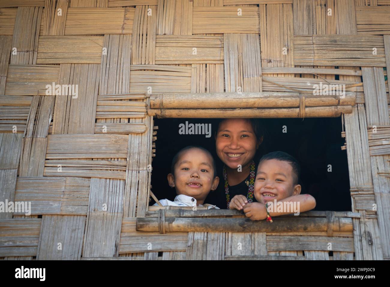 Bandarban, Bangladesh. 17th Jan, 2024. A Mro woman poses for a portrait with her children. Mro people are an indigenous ethnic group in Bangladesh. They primarily inhabit the Chittagong Hill Tracts (CHT) region, which includes districts such as Bandarban, Rangamati, and Khagrachari. The Mro people are one of the many indigenous communities in Bangladesh, and they have a distinct cultural identity, language, and traditional way of life. (Credit Image: © Piyas Biswas/SOPA Images via ZUMA Press Wire) EDITORIAL USAGE ONLY! Not for Commercial USAGE! Stock Photo
