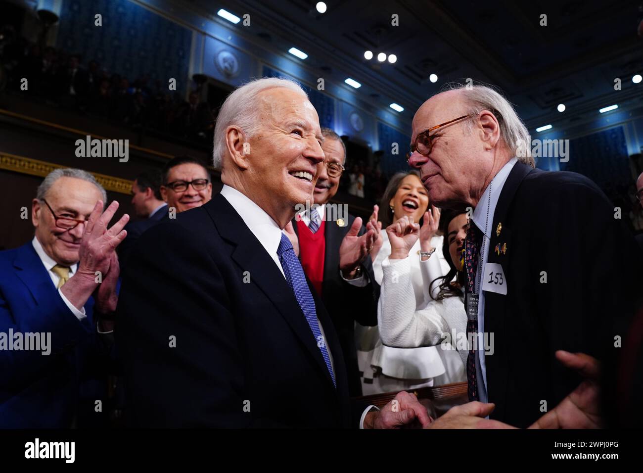 US President Joe Biden (C) arrives to the House Chamber of the US