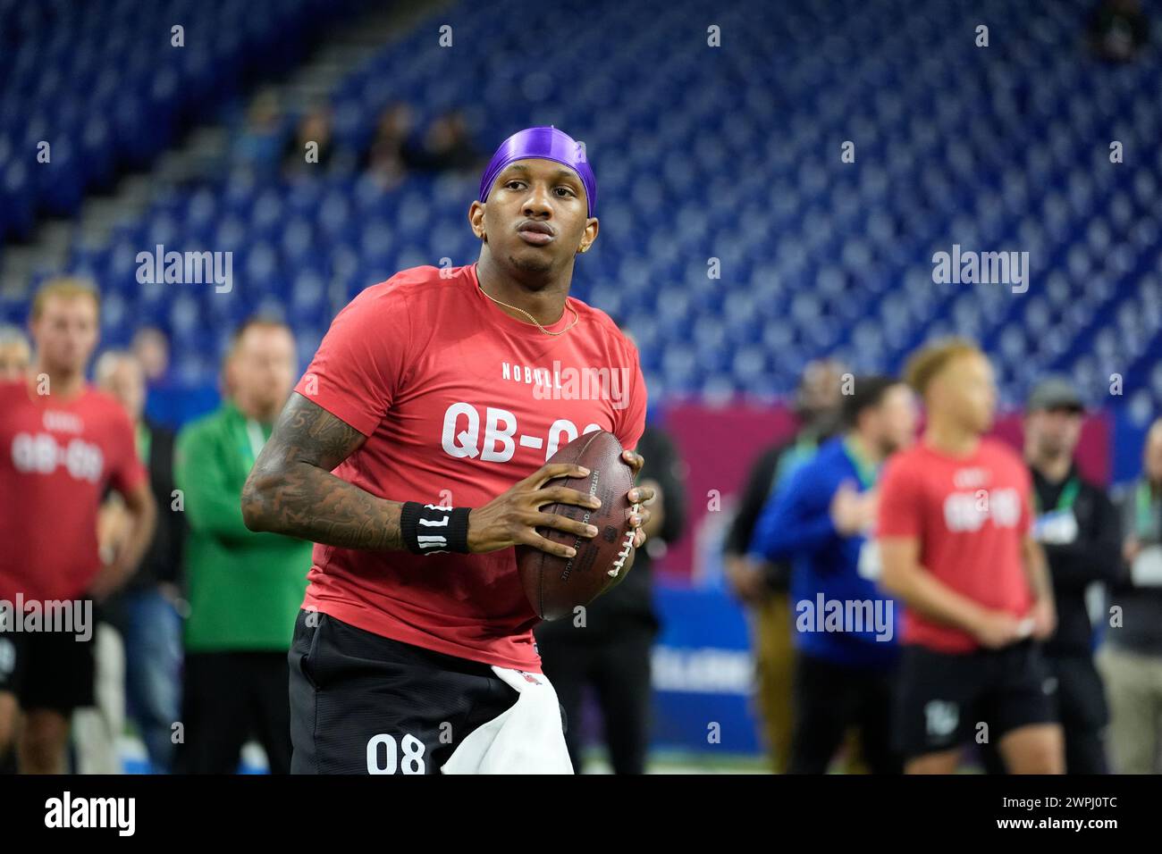 Washington quarterback Michael Penix runs a drill at the NFL football