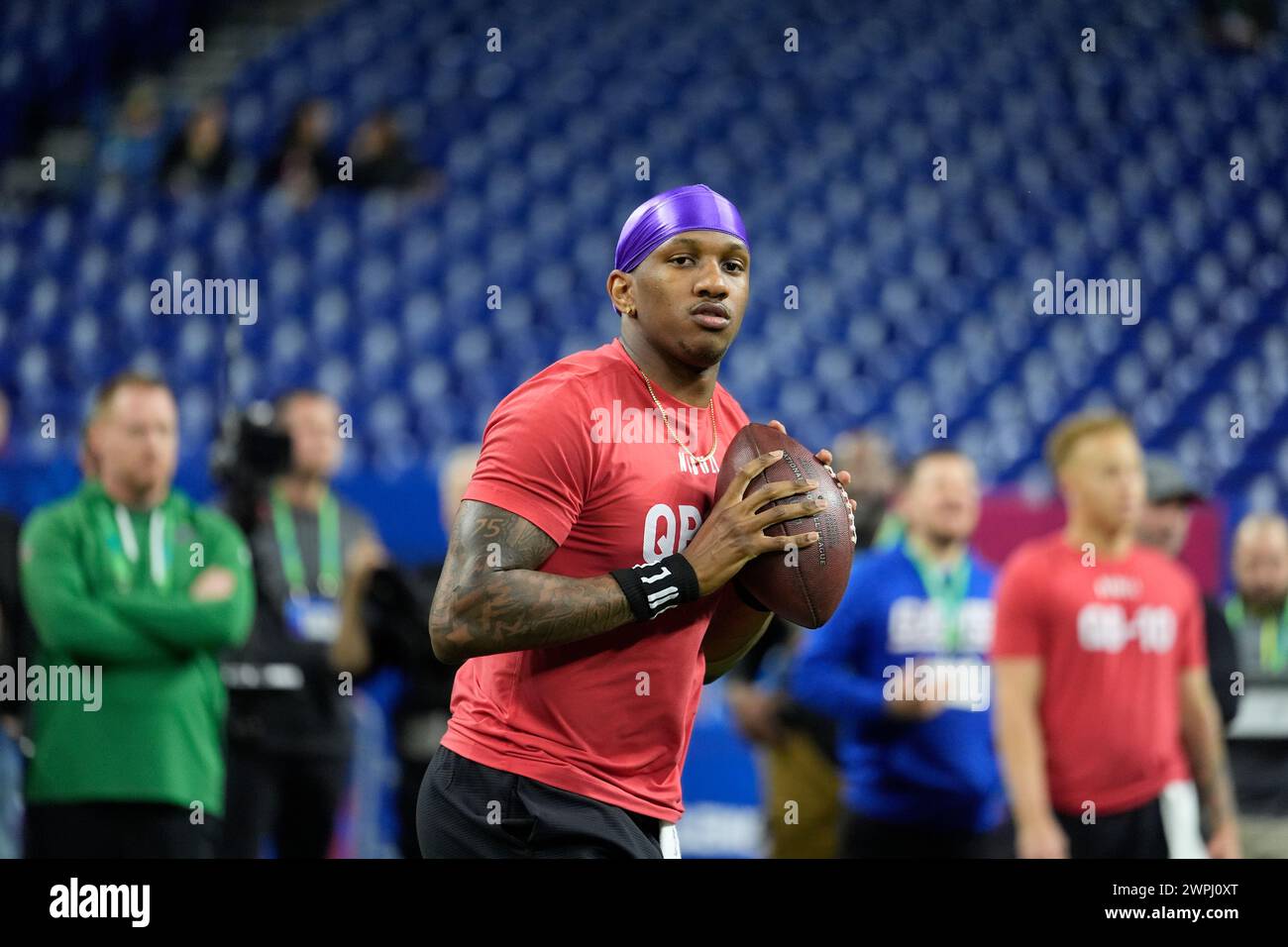 Washington quarterback Michael Penix runs a drill at the NFL football
