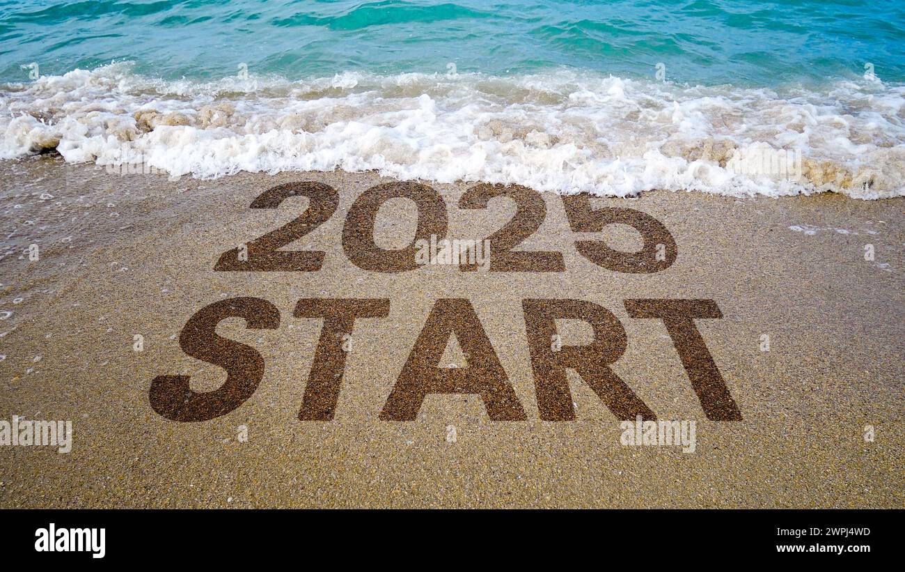 Beautiful beach waves wash away 2024 towards the new year 2025 Stock
