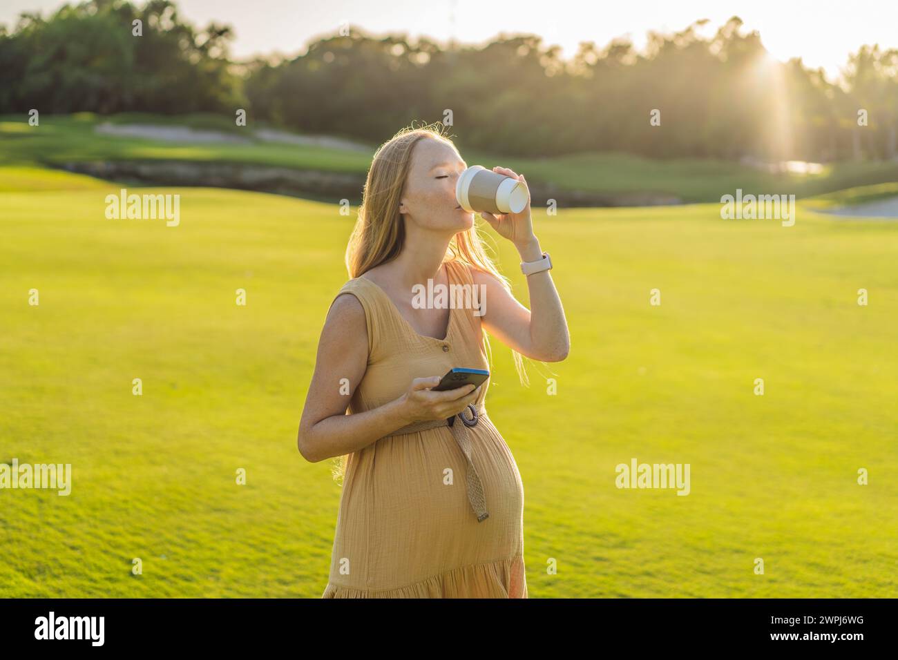 pregnant woman enjoys a cup of coffee outdoors, blending the simple