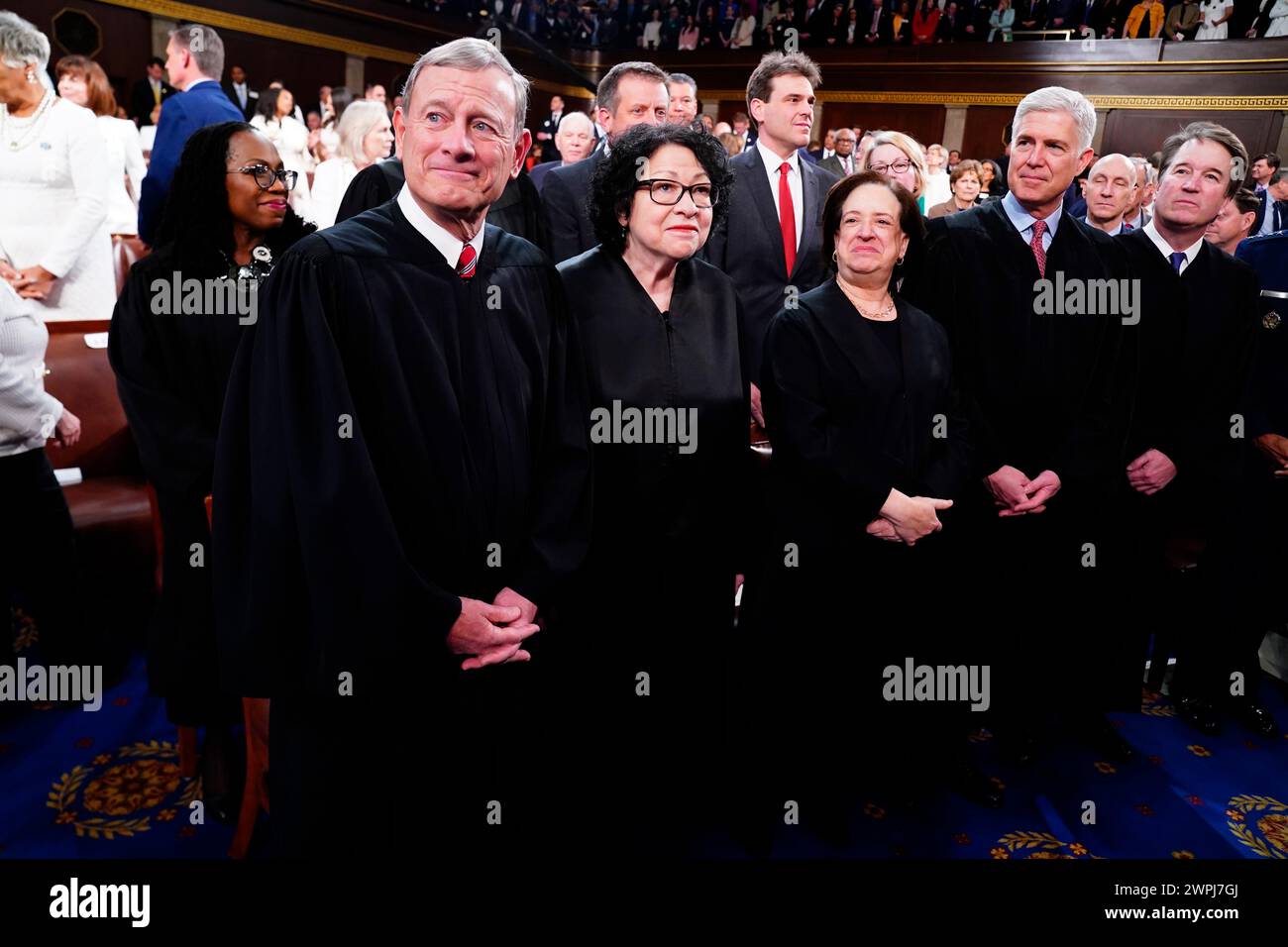 Washington, DC, USA. 07th Mar, 2024. Chief Justice of the United States John G Roberts, Jr. (L), along with Associate Justices (L-R) Sonia Sotomayor, Elena Kagan, Neil Gorsuch, and Brett Kavanaugh stand in the House of Representatives ahead of US President Joe Bidens third State of the Union address to a joint session of Congress in the US Capitol in Washington, DC, USA, 07 March 2024. Credit: Shawn Thew/Pool via CNP/dpa/Alamy Live News Stock Photo