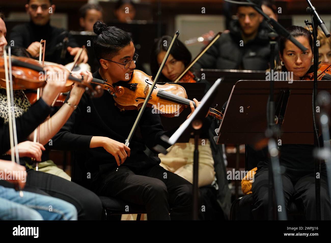 Members of the Afghan Youth Orchestra (AYO) practice for their Breaking the Silence tour at London's Southbank Centre, Royal Festival Hall. The Home Office initially refused the AYO's application for visas, but after the provision of additional information, the government department granted them entry. Picture date: Thursday March 7, 2024. Stock Photo