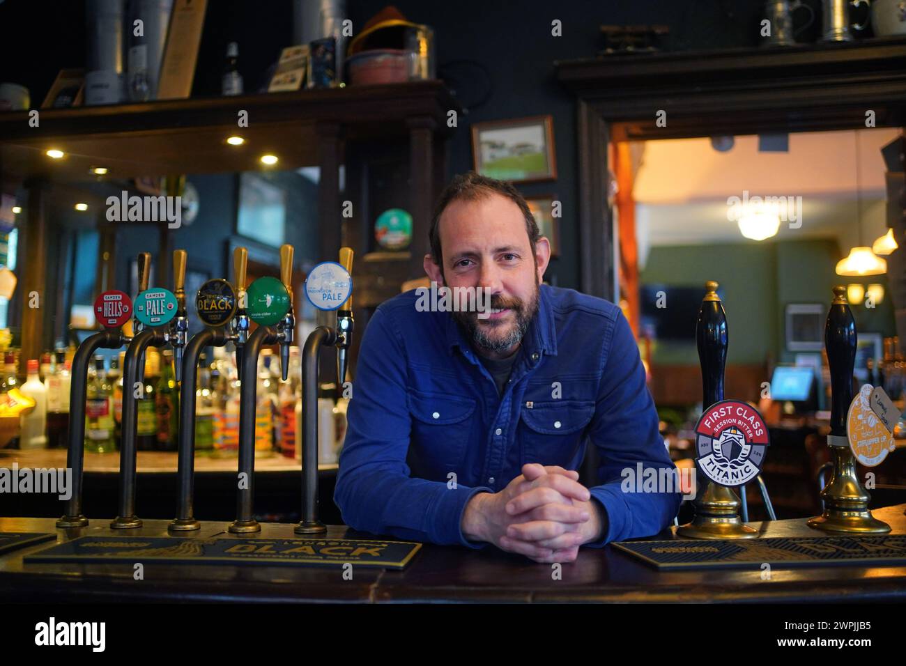 Ben Martin, one of the co-owners of the Carlton Tavern in Maida Vale, London, who along with his business partner Tom Rees had to rebuild his pub after it was illegally torn down in 2015. Rebuilding a pub from the rubble is a difficult task but it is one Ben and Tom found immensely rewarding. The Crooked House pub in Dudley faces a similar future after it was destroyed in a suspicious fire in August 2023. Picture date: Thursday February 29, 2024. Stock Photo