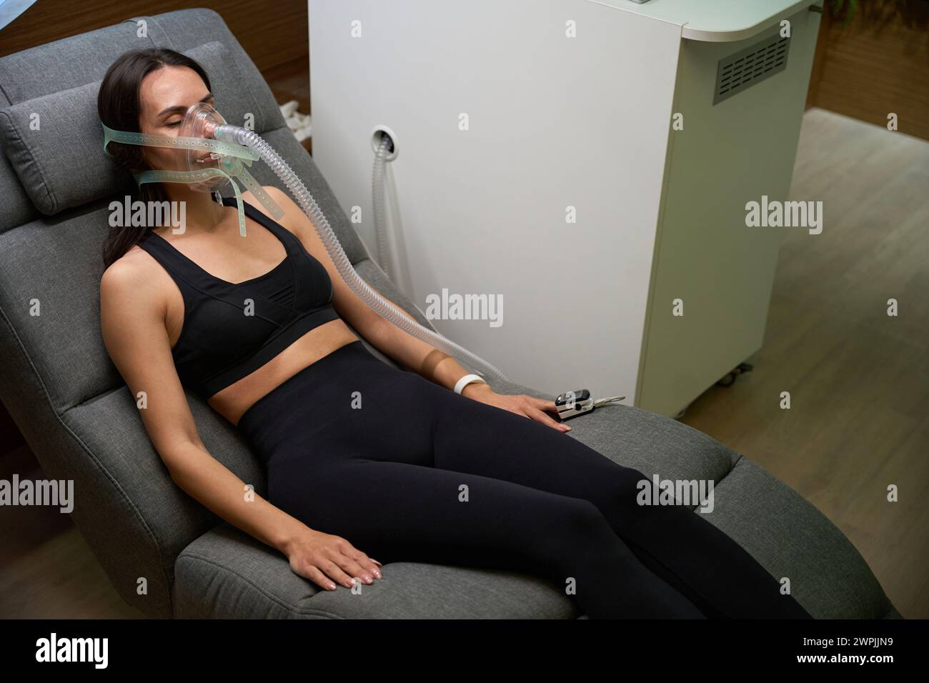 Lady lying on couch, recovery and treatment procedure Stock Photo Alamy