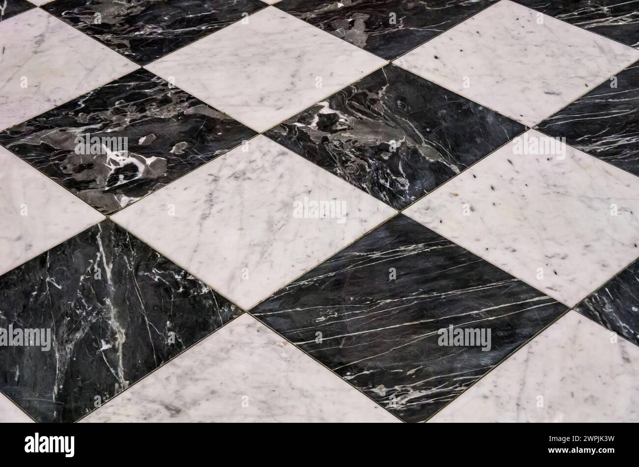 Checkerboard pattern on a stone floor. Stock Photo
