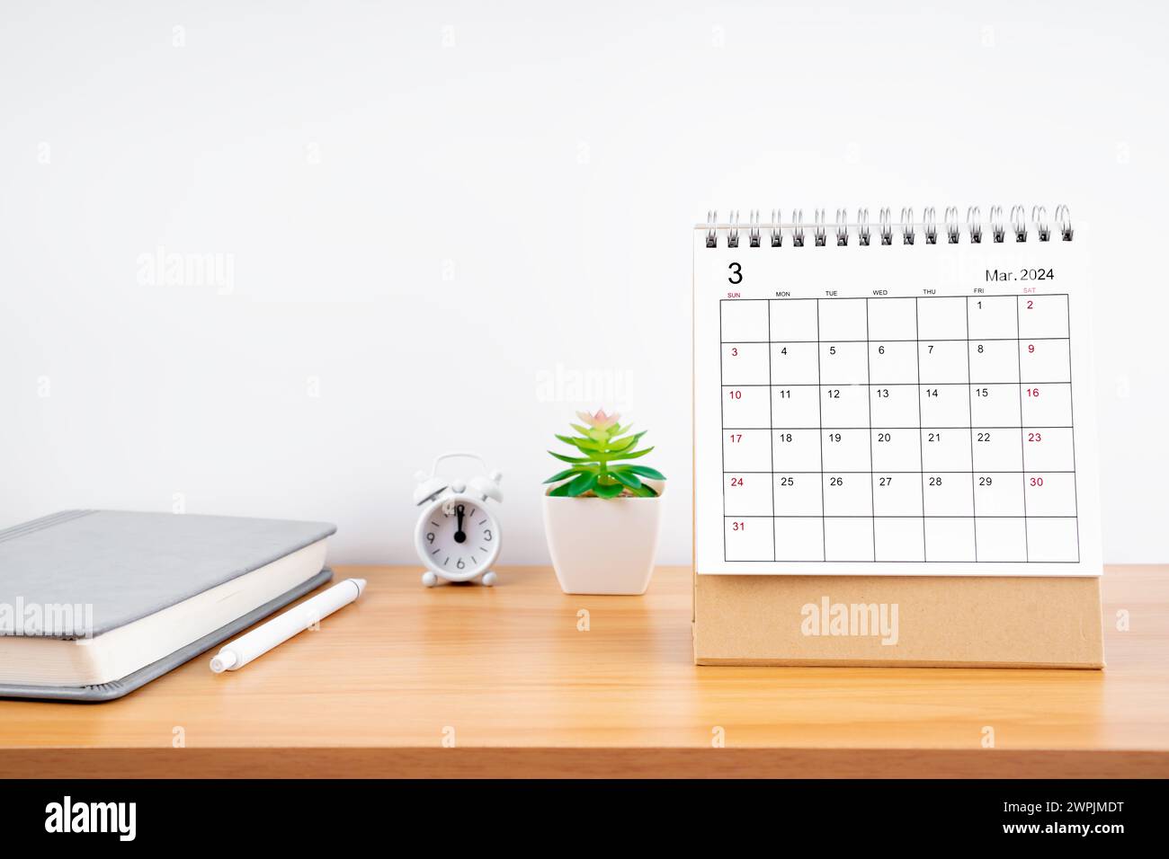 March 2024, Monthly desk calendar for 2024 year on wooden table with ...