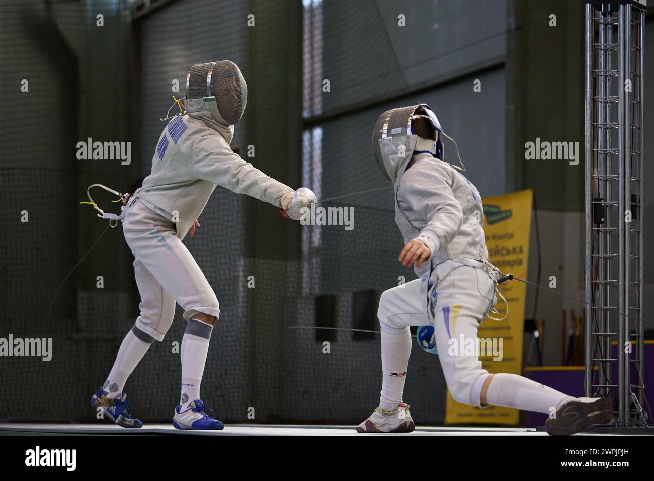 Ukrainian fencers Oleksandr Hryhoruk (left) and Iurii Kulesha fighting