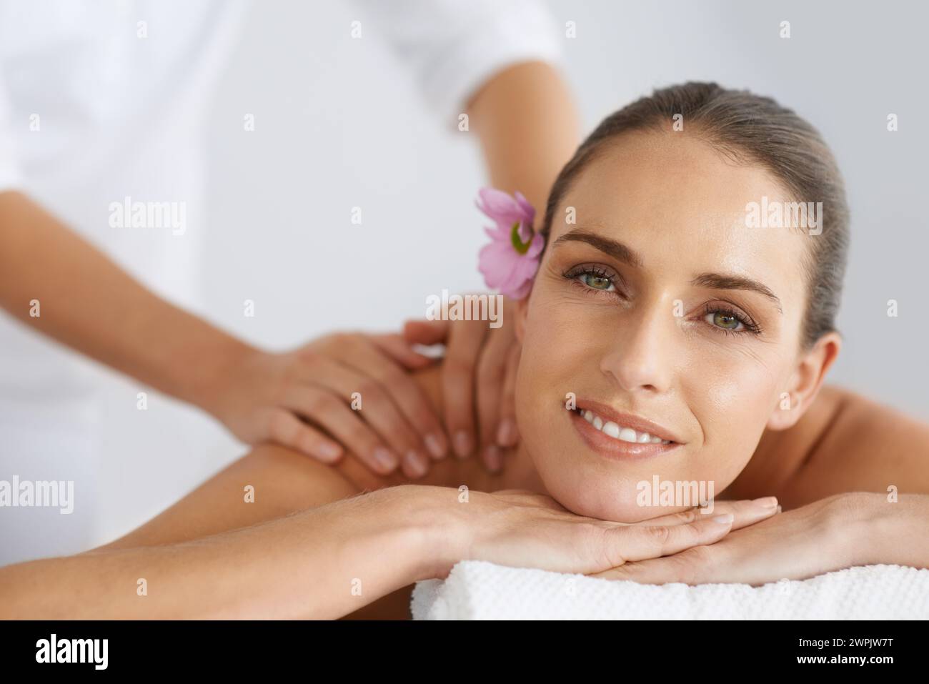 Relax, massage and portrait of woman at spa for health, wellness and balance with luxury holistic treatment. Self care, peace and girl on table for Stock Photo