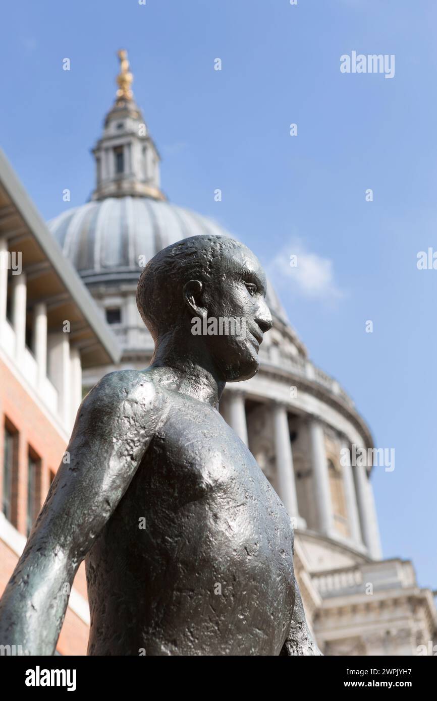 UK, London, statue of man driving sheep to market titled 'Shepherd and sheep' in Paternoster square with the Dome of St Pauls Cathedral in the backgro Stock Photo