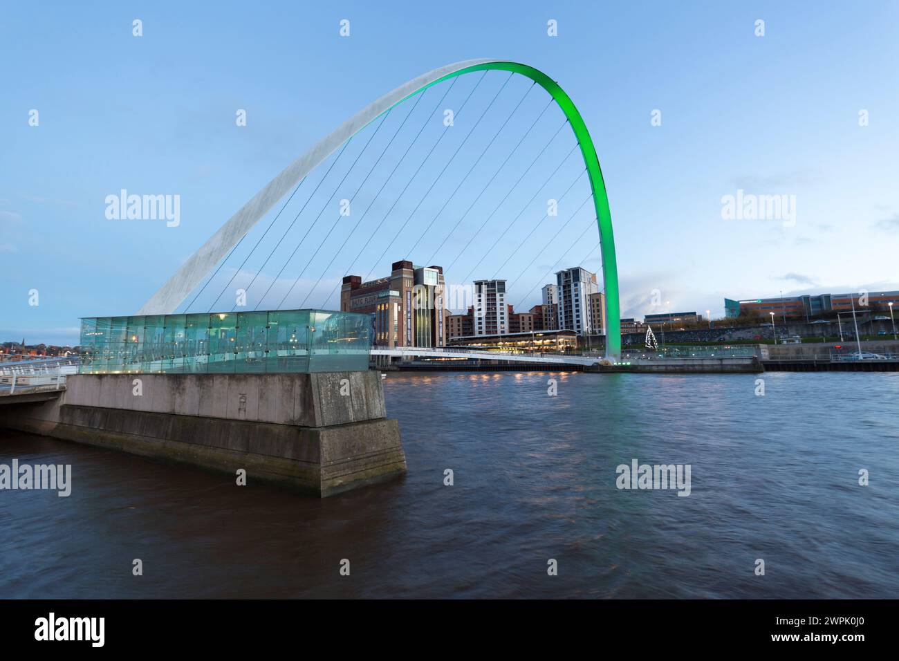 UK, Newcastle upon Tyne, the Gateshead Millennium Bridge over the river Tyne and the Baltic Centre for Ceontemporary Art. Stock Photo