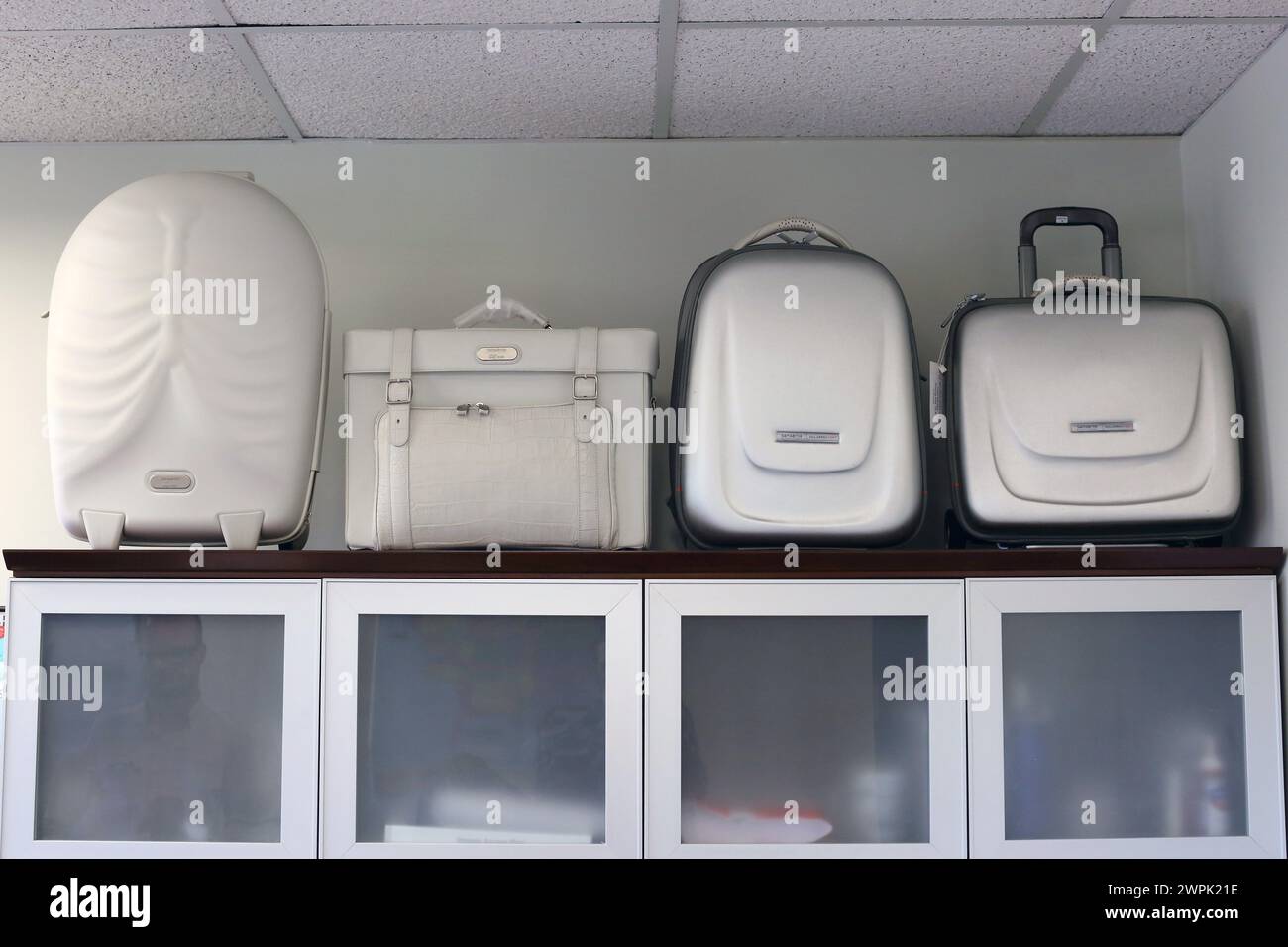 White suitcases range and travel luggage of globetrotter Stock Photo