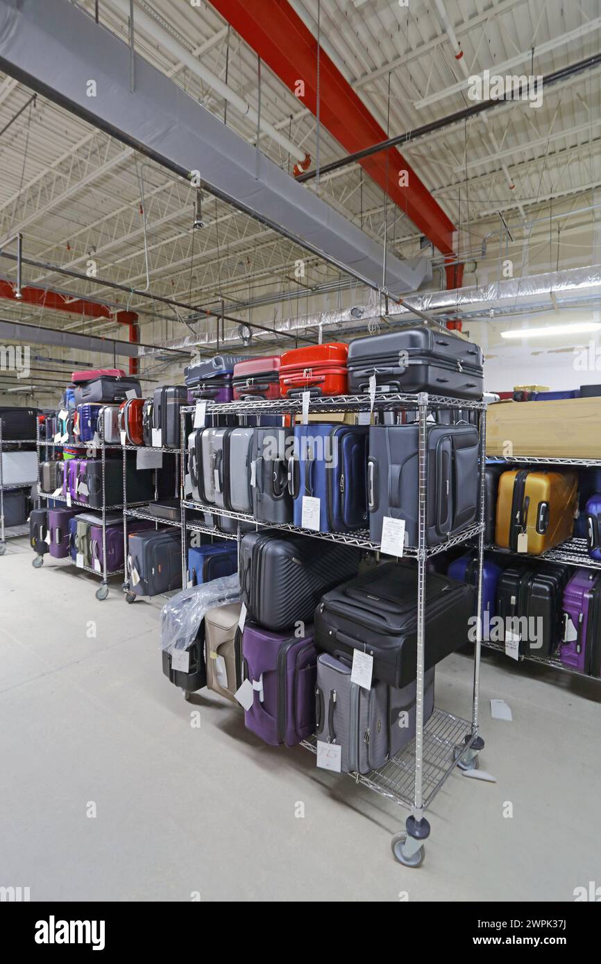 Various suitcases and luggage in storage room Stock Photo